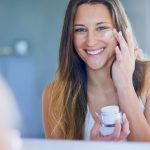Smiling woman loves her new skin care routine.